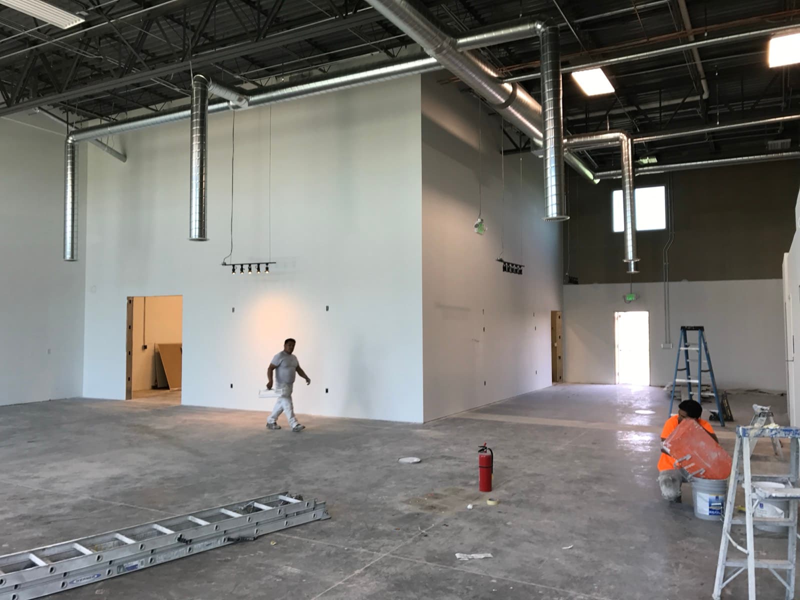 Autotelic jobsite mid-build — high-bay commercial shell during a tenant finish