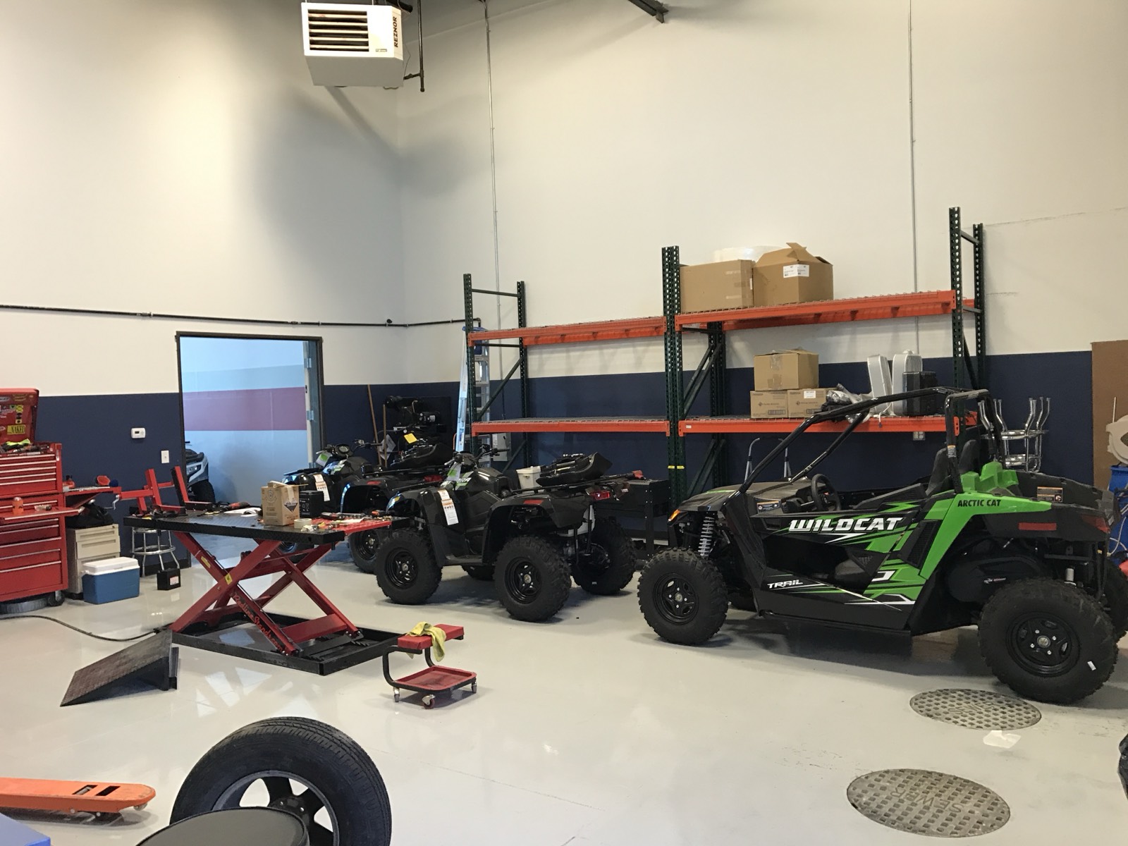 Finished service department with ATVs staged on the shop floor