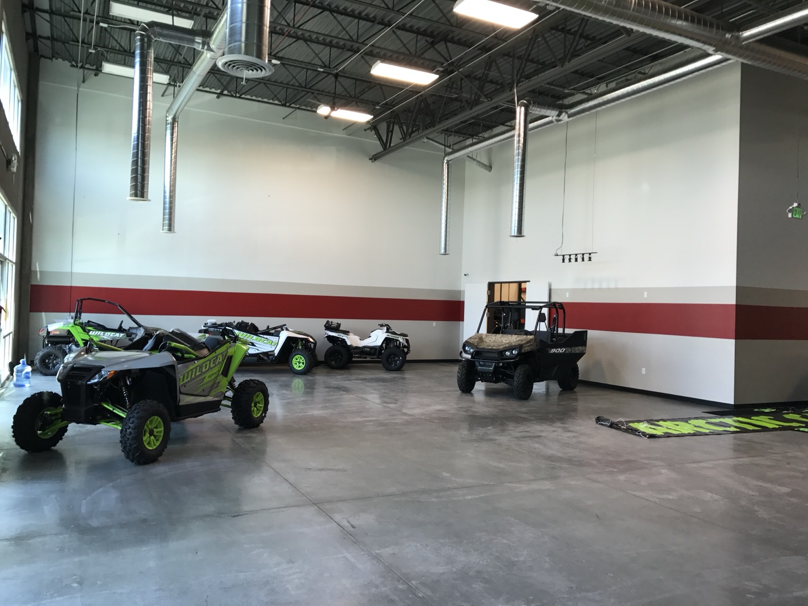 Finished showroom at delivery — polished floors, inventory staged