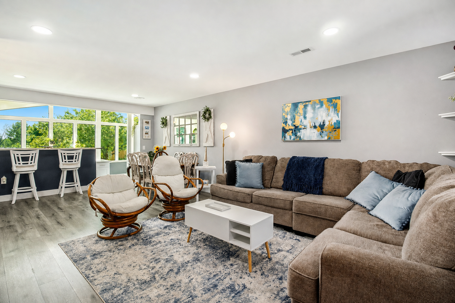 Living room opening to the sunroom bar