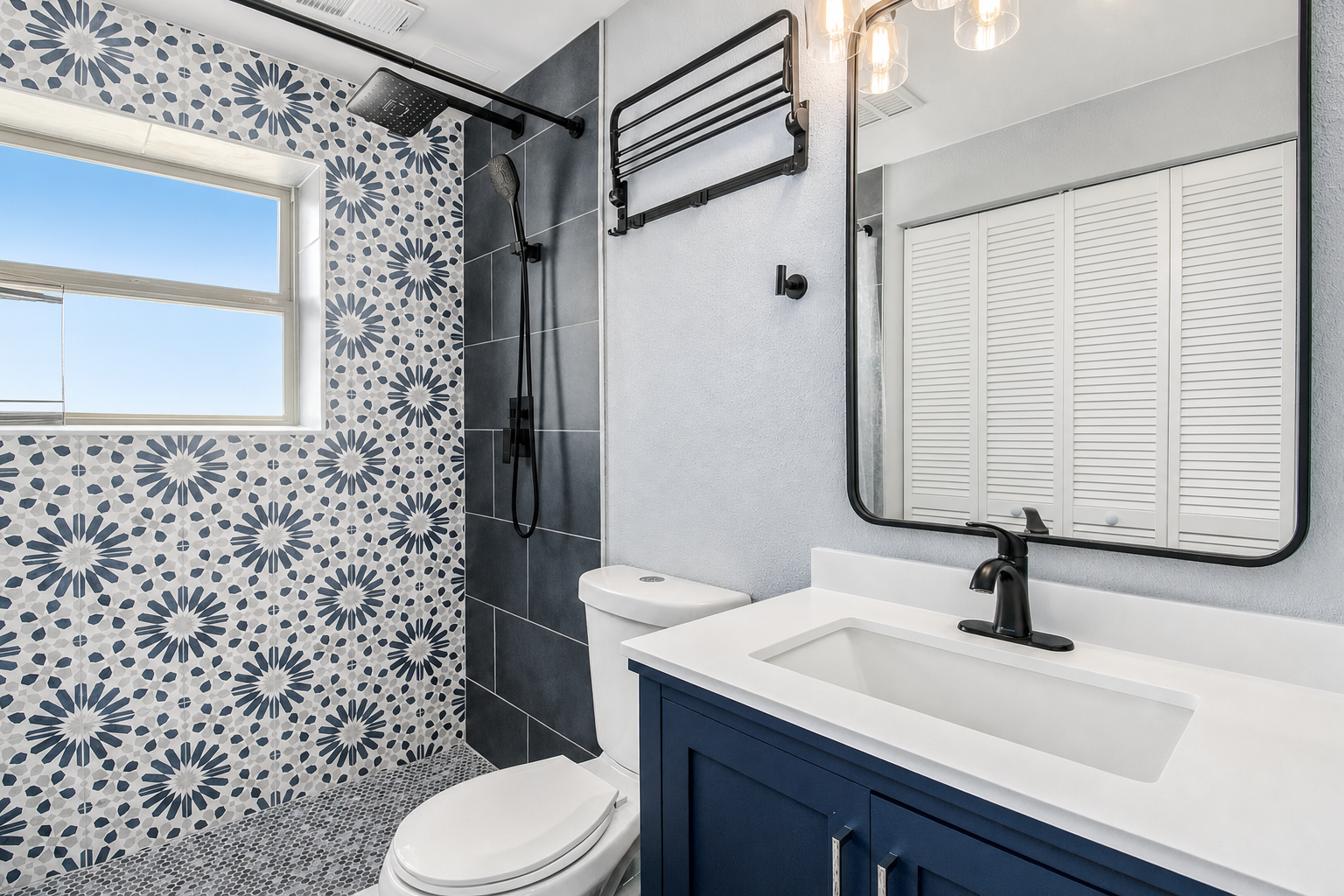 Second bath with patterned tile and navy vanity
